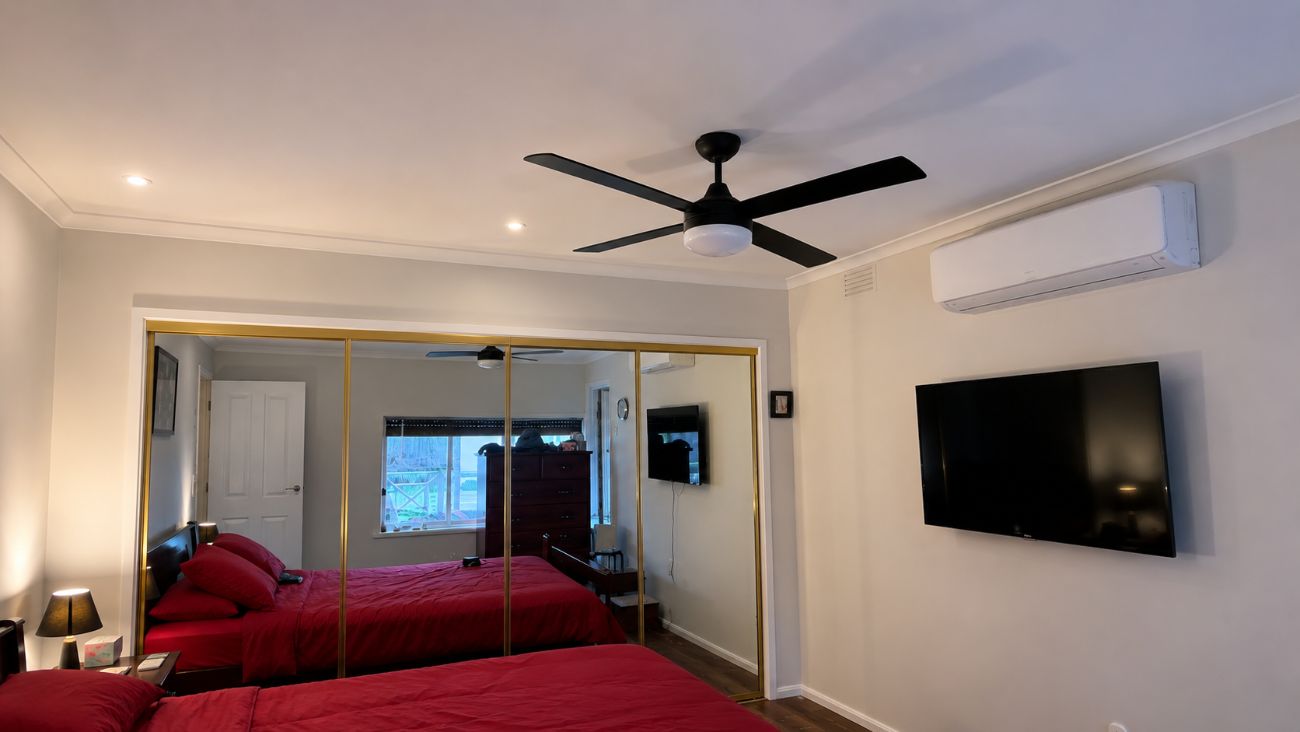 Ceiling fan and split system installed in bedroom by DTW Electrical