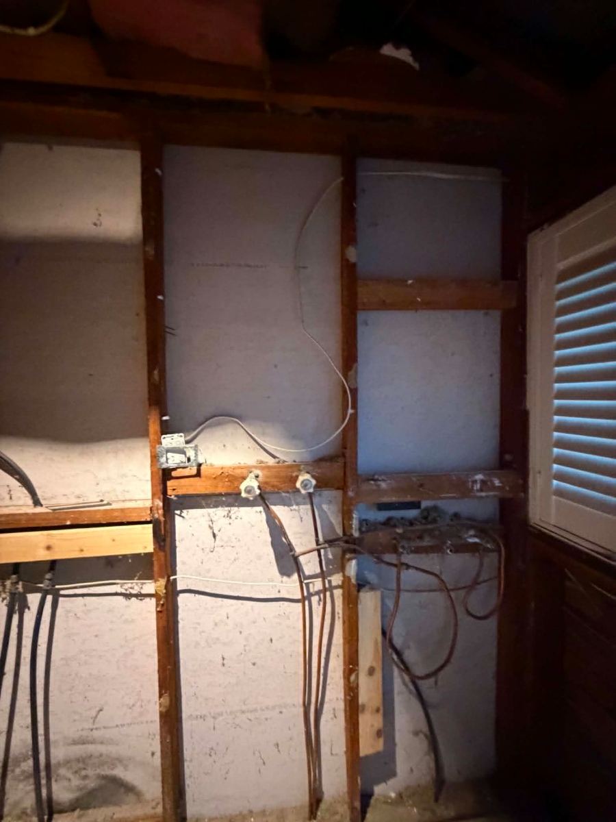 Bathroom stripped to the frame during a rewire in Melton South